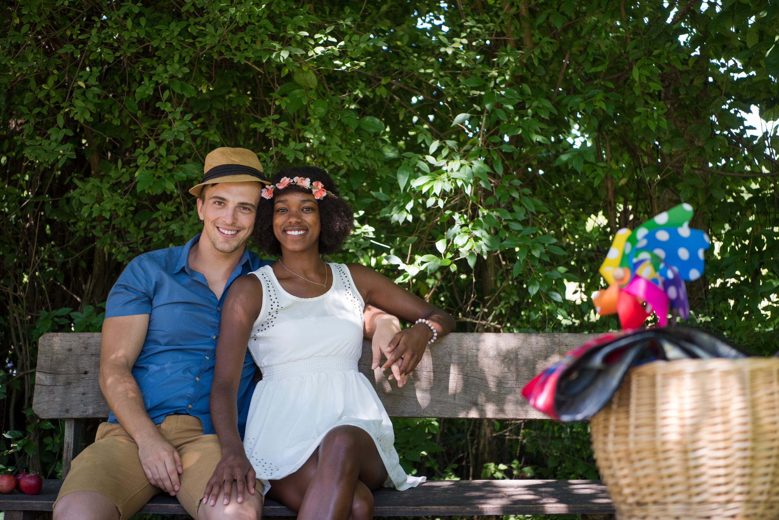 Young multiethnic couple having a bike ride in nature - Tennis Destination