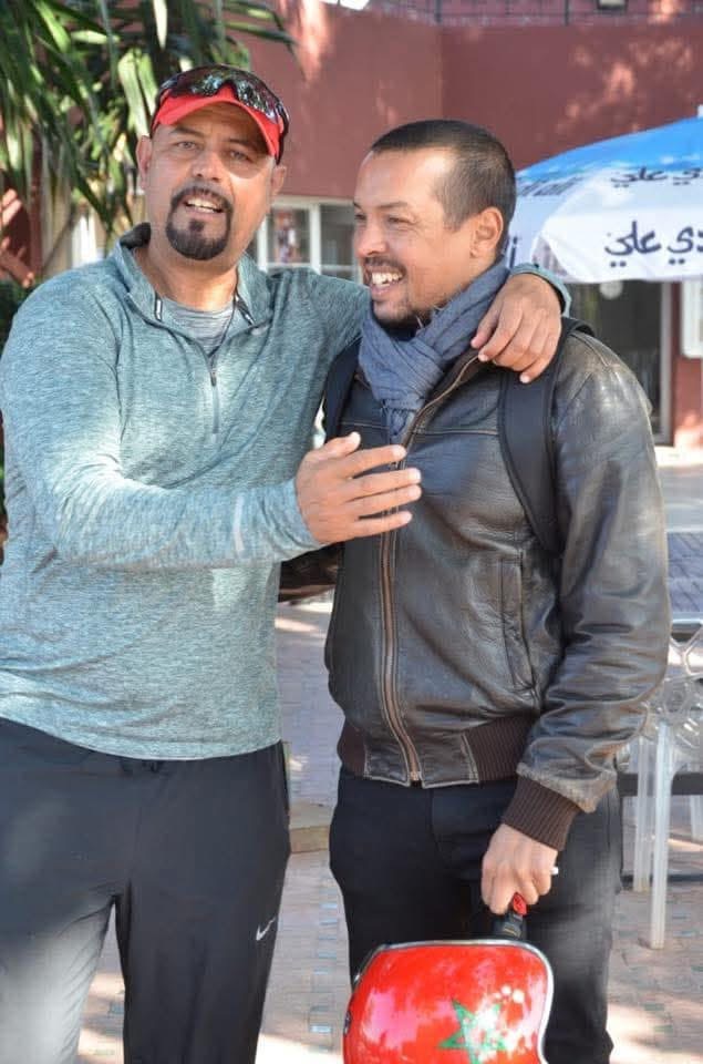 Coach Mo welcoming travelers in Morocco
